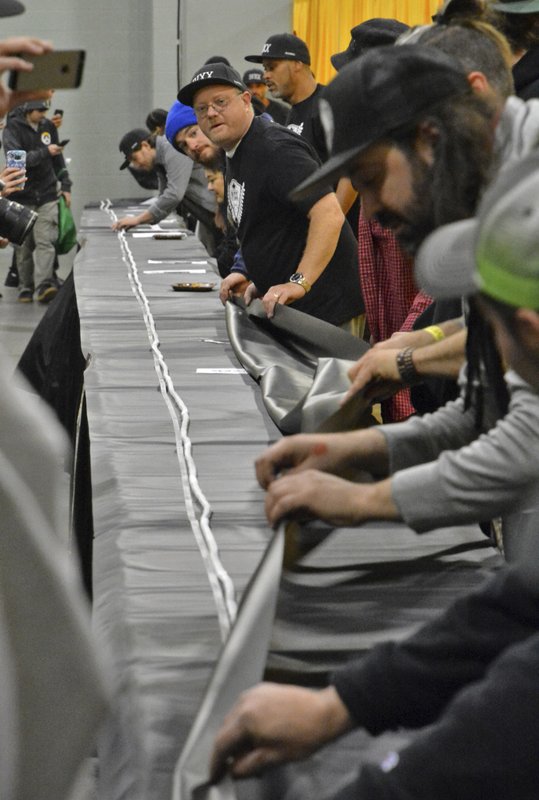 Massachusetts marijuana aficionados roll 100-foot-long joint