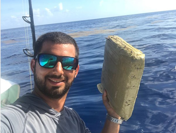 fisher man snares brick of marijuana